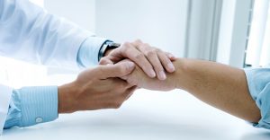 Image of a supportive handshake.