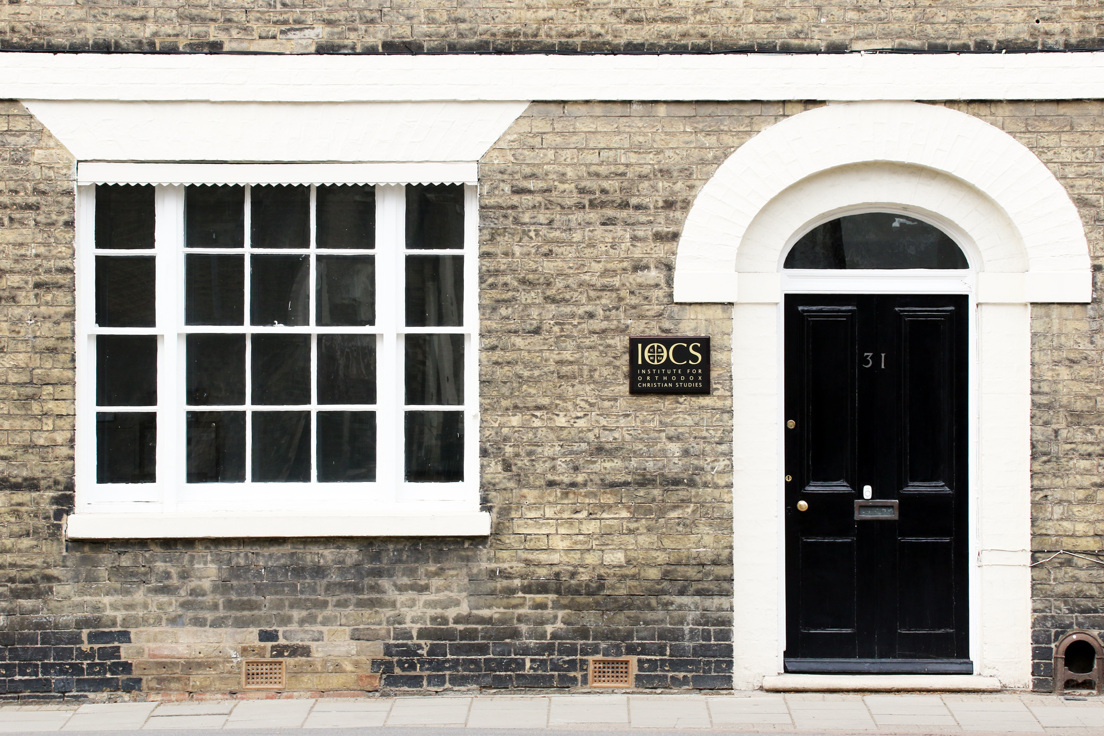 Image depicting entrance door to IOCS with window.