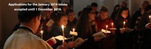 Image showing participants in church service with candles.