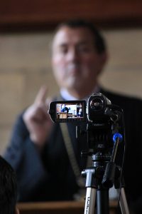 Image of video camera filming Father Ioan Sauca, during IOCS lecture.