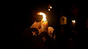 Lit candles in the dark.