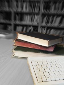 Stylised image of books and keyboard in IOCS Library.